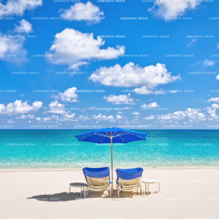 Two deck chairs sit on Cabbage Beach, Paradise Island, in The Bahamas