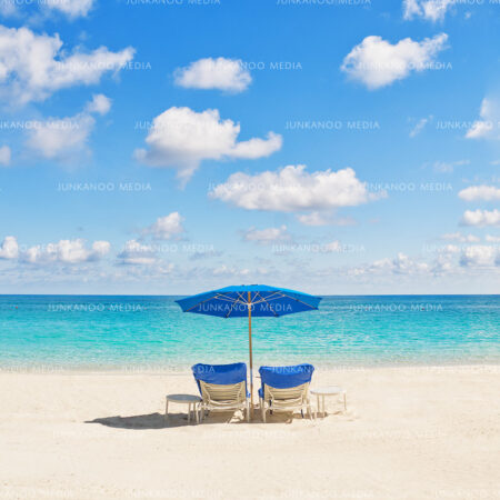 Deck chairs under a blue sky on Cabbage Beach, Paradise Island, Bahamas